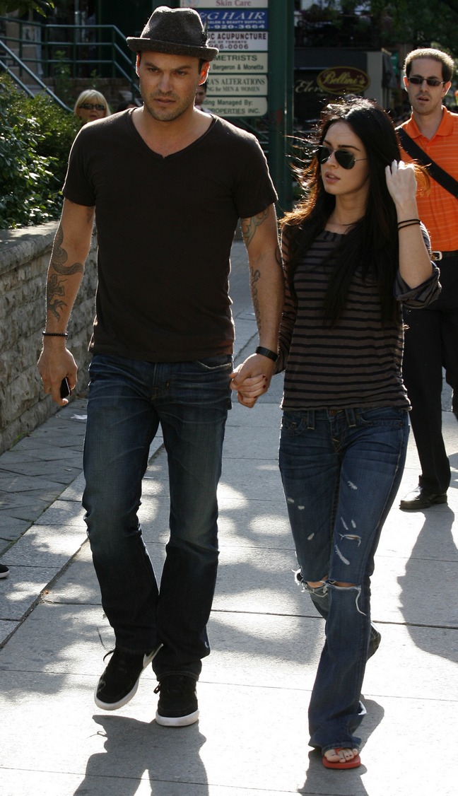 Megan Fox, gray and black striped shirt, red flip flops, jeans, sunglasses, Brian Austin Green, fedora, brown tshirt, jeans, black shoes